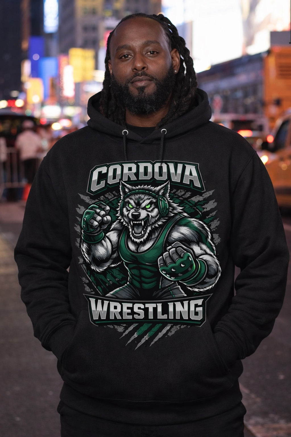 Person wearing a black hoodie with 'Cordova Wrestling' graphic in an urban setting